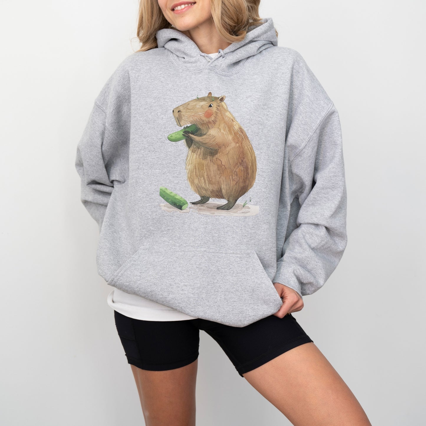 Capybara Eating Cucumber Unisex Hoodie – Cozy & Playful Sweatshirt