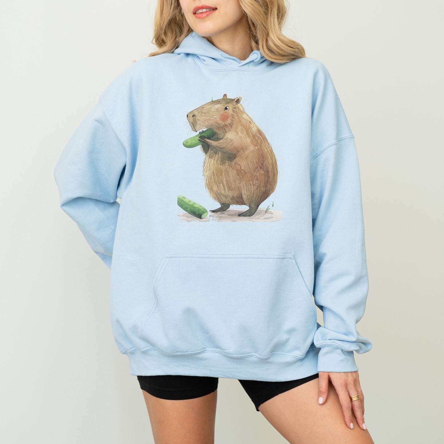 Capybara Eating Cucumber Unisex Hoodie – Cozy & Playful Sweatshirt