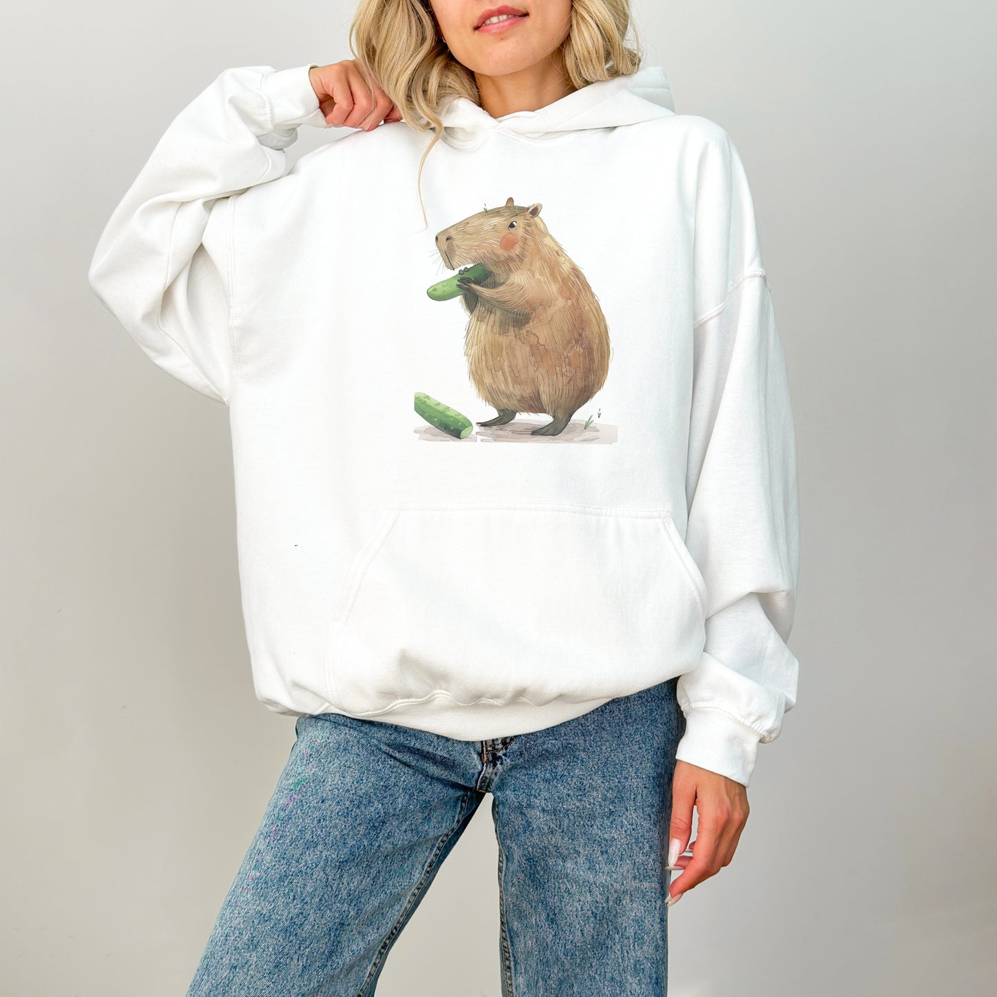 Capybara Eating Cucumber Unisex Hoodie – Cozy & Playful Sweatshirt